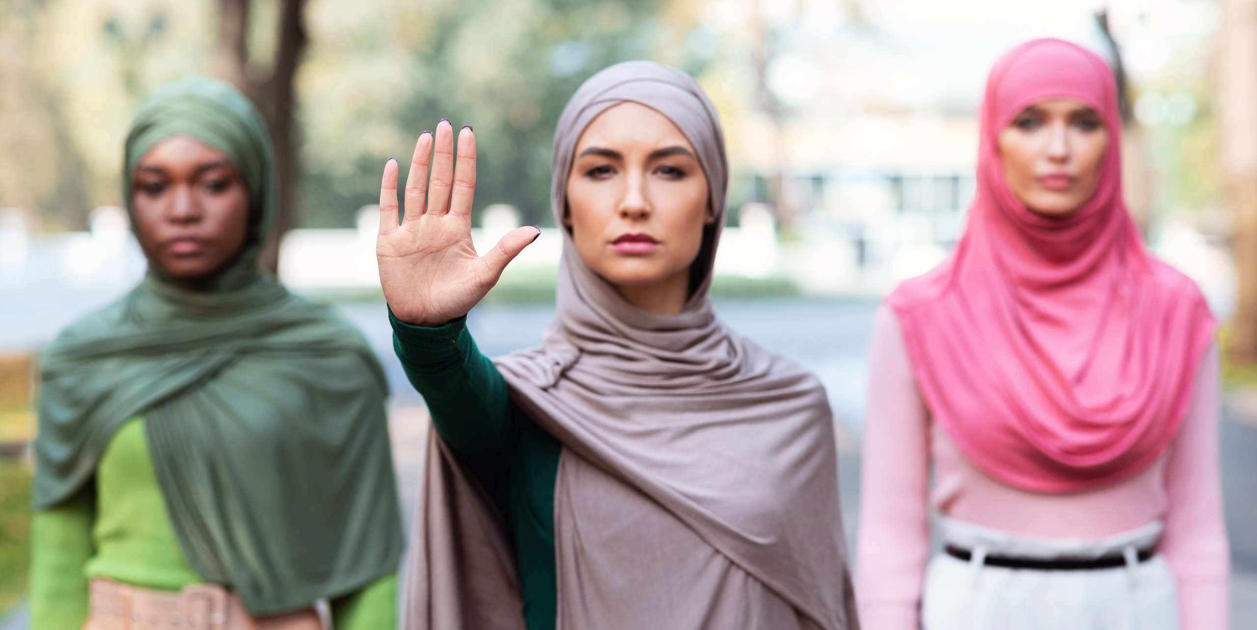 three muslim women gesturing stop protesting again 2022 10 07 01 08 14 utc scaled